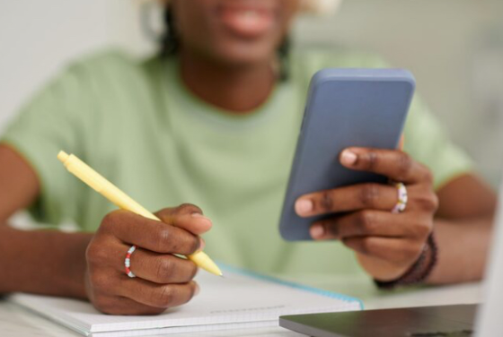 A teacher using a smart phone