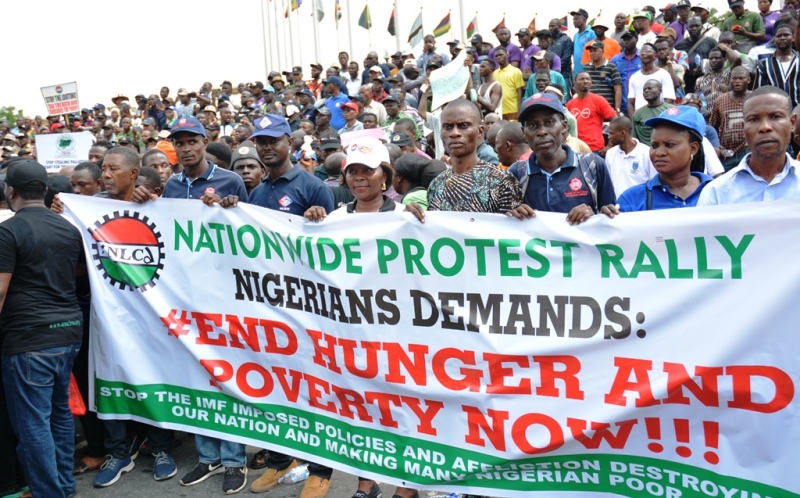 Protesters holding a banner during a nationwide rally in Nigeria, demanding an end to hunger and poverty.