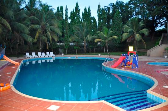 Guests relaxing by the infinity pool overlooking the Volta River in Akosombo, Ghana.