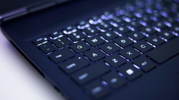 Close-up of a modern laptop keyboard used for software engineering.