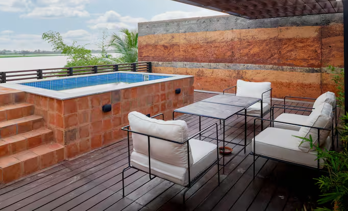 An interior view of a premium waterfront villa featuring local timber finishes along the Volta River, Ghana.