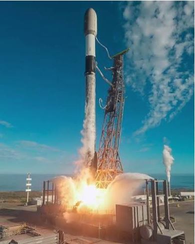 Bright rocket exhaust illuminating dark evening clouds during liftoff.