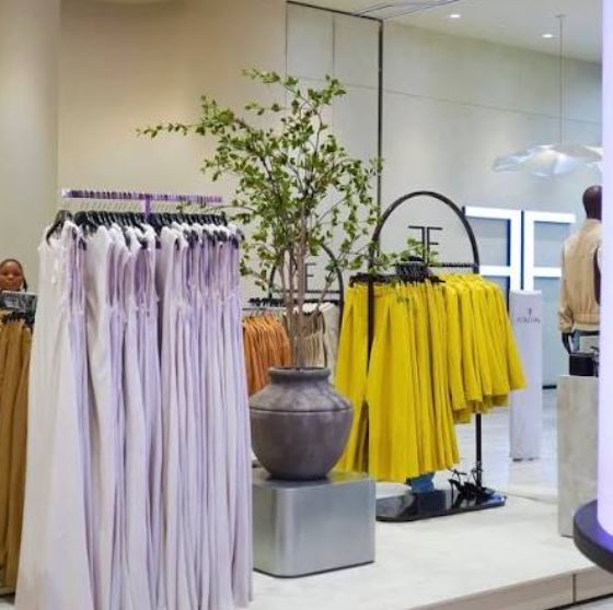 Retail clothing racks neatly organized inside a modern boutique.