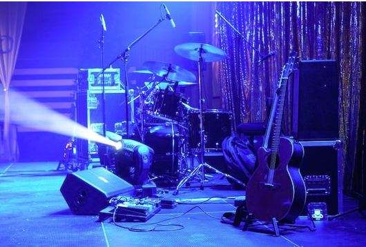 Microphone set up on a concert stage prior to a live performance.