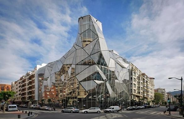 Modern glass architecture and steel structures of a major European civic building.